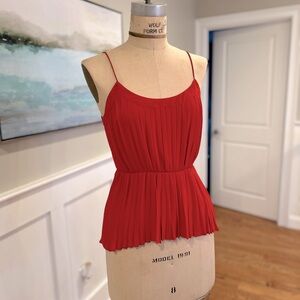 Spaghetti strap, pleated top in reddish orange, size Small.